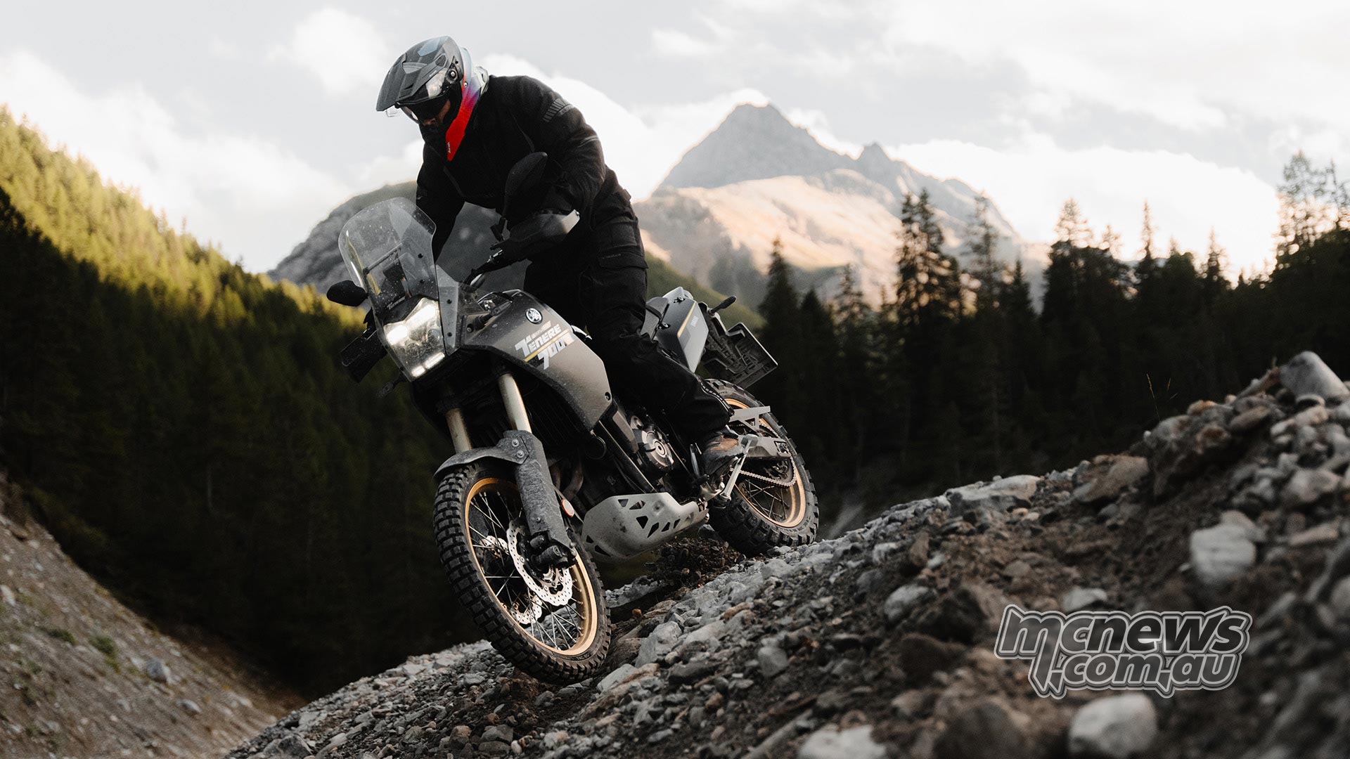 Yamaha Tenere 700 equipped with Continental TKC 80² adventure tyres negotiating a steep rocky descent in mountainous terrain