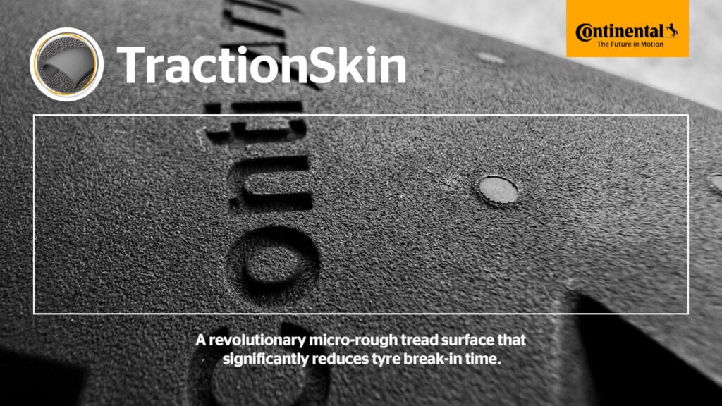 Close-up Continental TractionSkin graphic showing the micro-rough surface of a new motorcycle tyre tread.