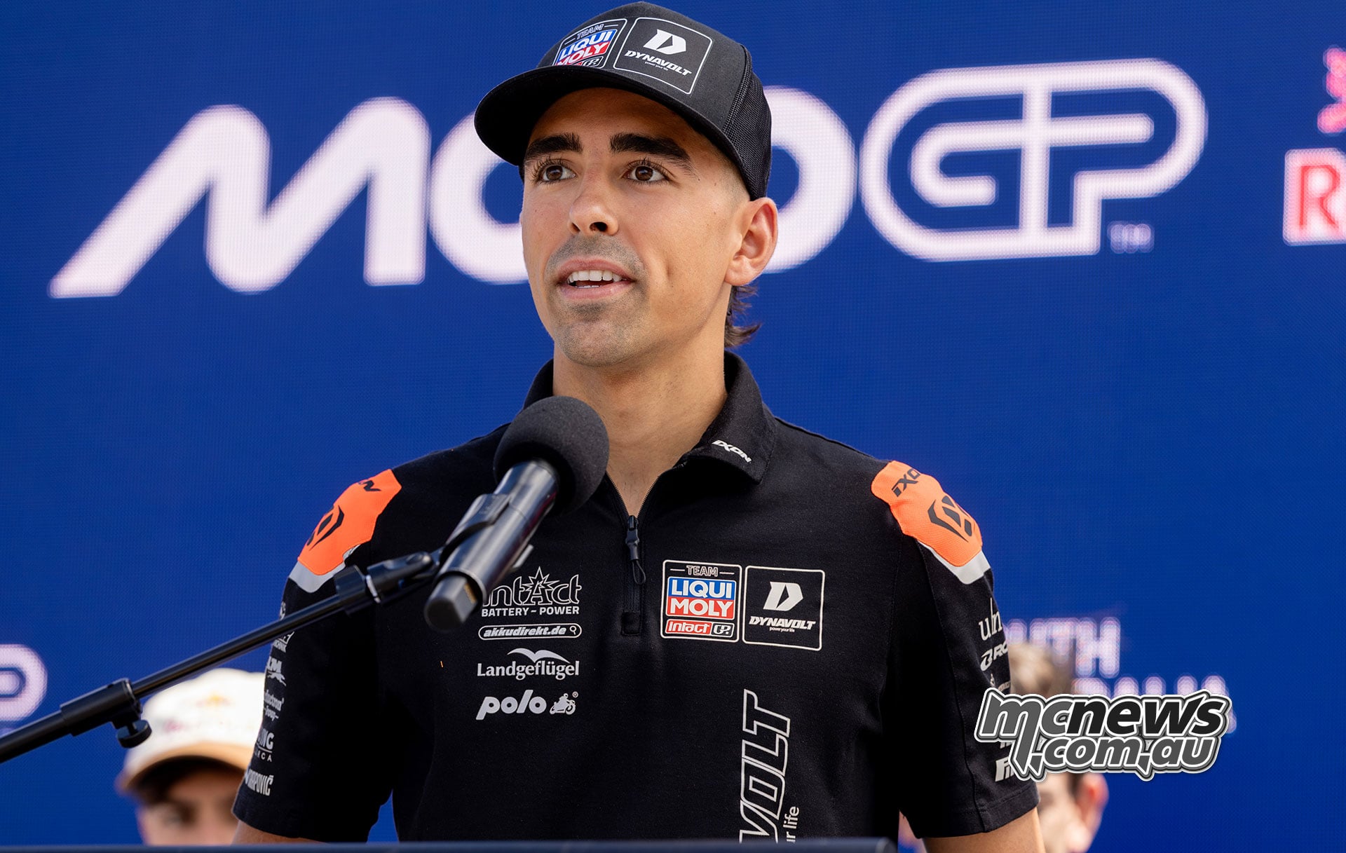 Senna Agius addresses the Adelaide MotoGP press conference wearing his Intact GP team shirt and cap