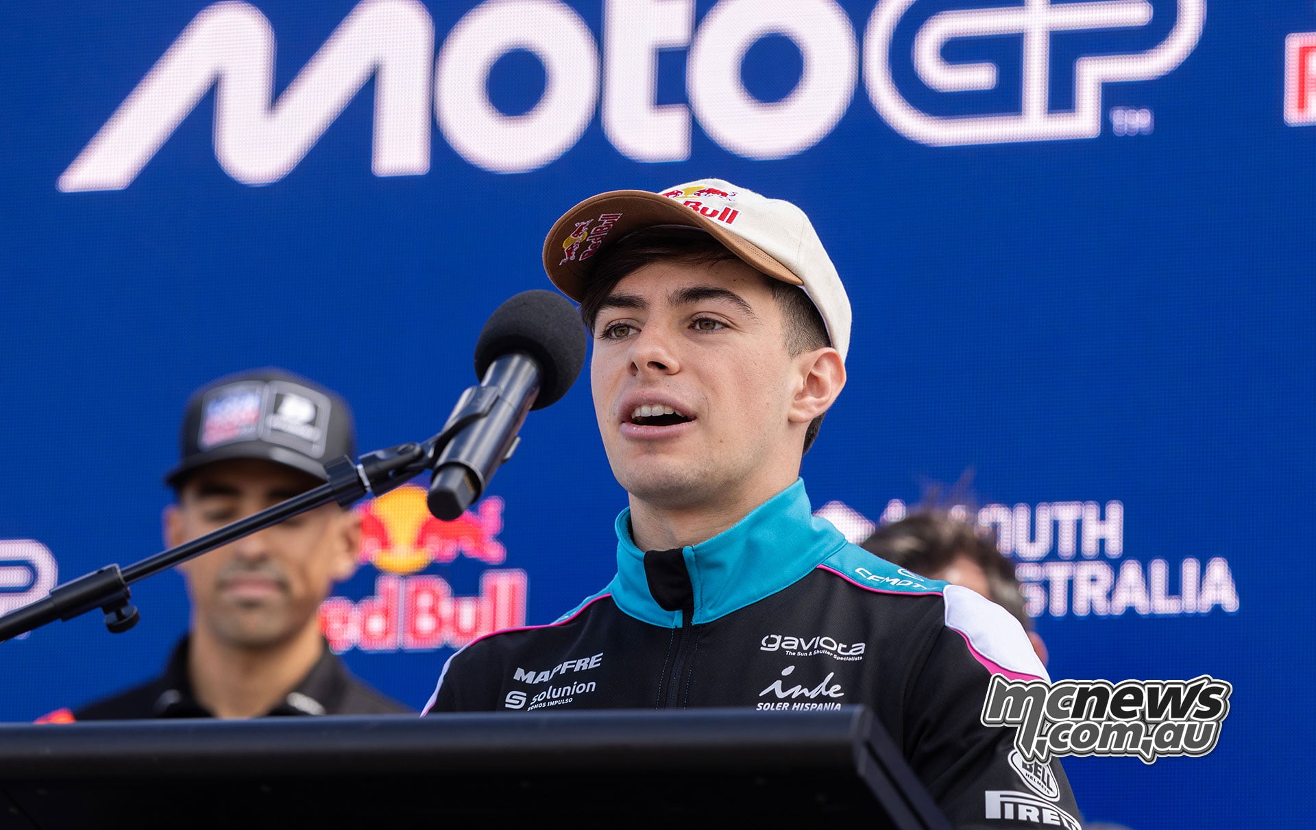David Alonso speaks at the Adelaide press conference wearing his CFMOTO team jacket and Red Bull cap