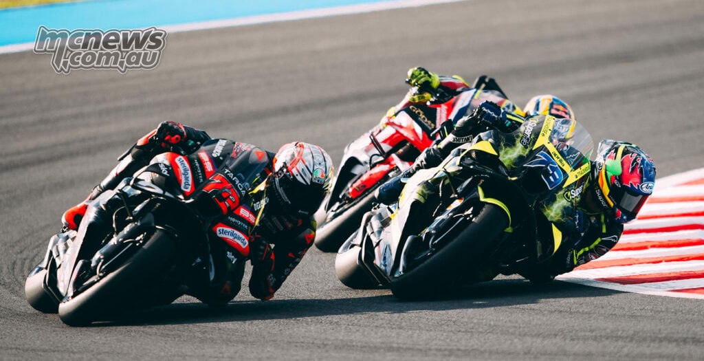Marco Bezzecchi, Ai Ogura and Diogo Moreira battle for position during the Motegi MotoGP Sprint.