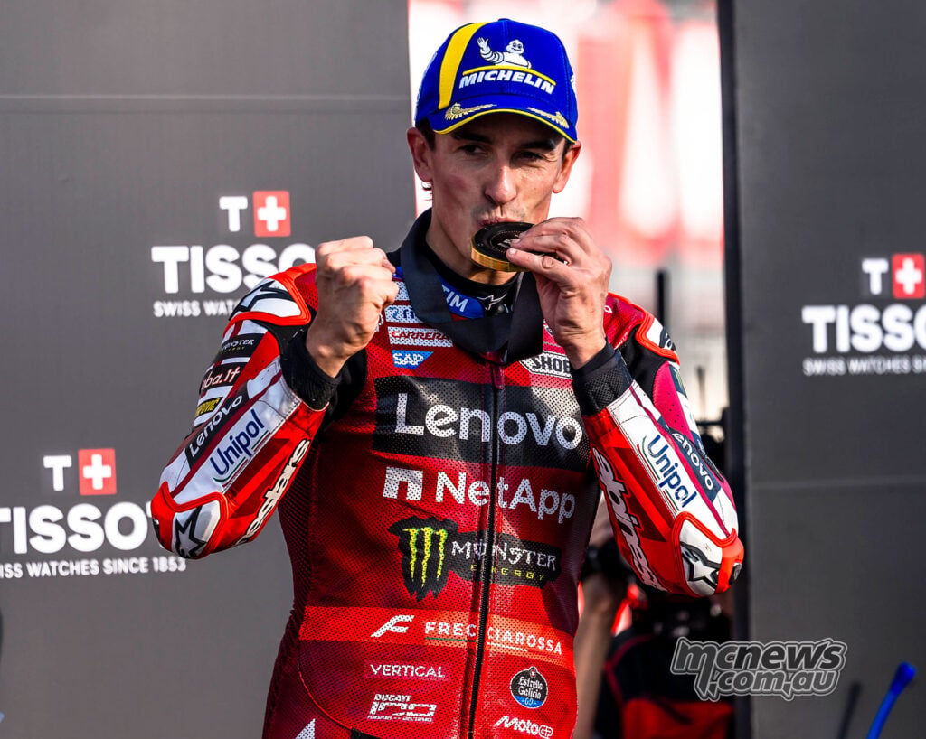 Marc Marquez celebrates his Motegi Sprint victory with his winner's medal.