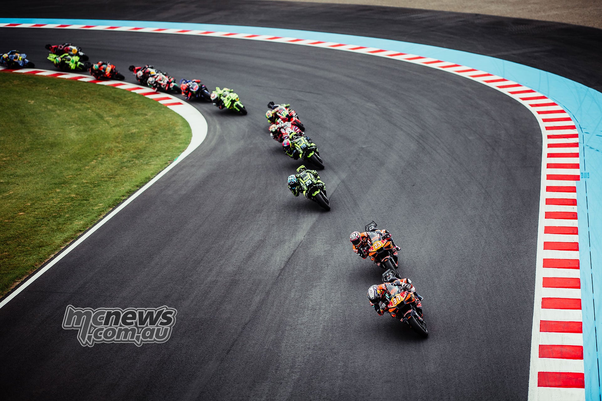 MotoGP riders including Pedro Acosta Enea Bastianini Ai Ogura Raul Fernandez Francesco Bagnaia Diogo Moreira and Fabio Di Giannantonio racing at Motegi