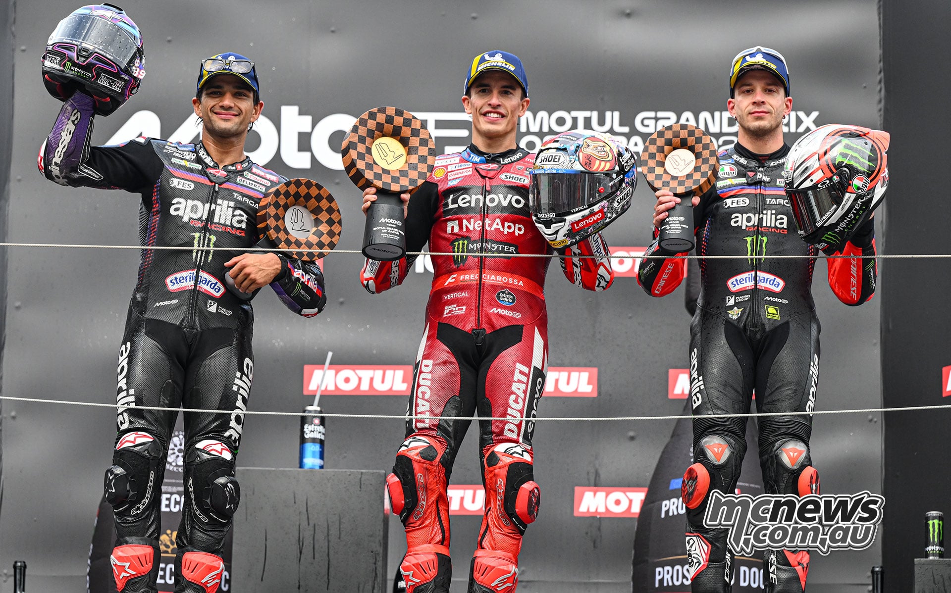 Jorge Martin Marc Marquez and Marco Bezzecchi on the Japanese MotoGP podium at Motegi