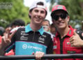 Máximo Quiles, left, makes a peace sign beside Marc Márquez, who gives a thumbs-up, during the 2026 Mandalika rider parade.