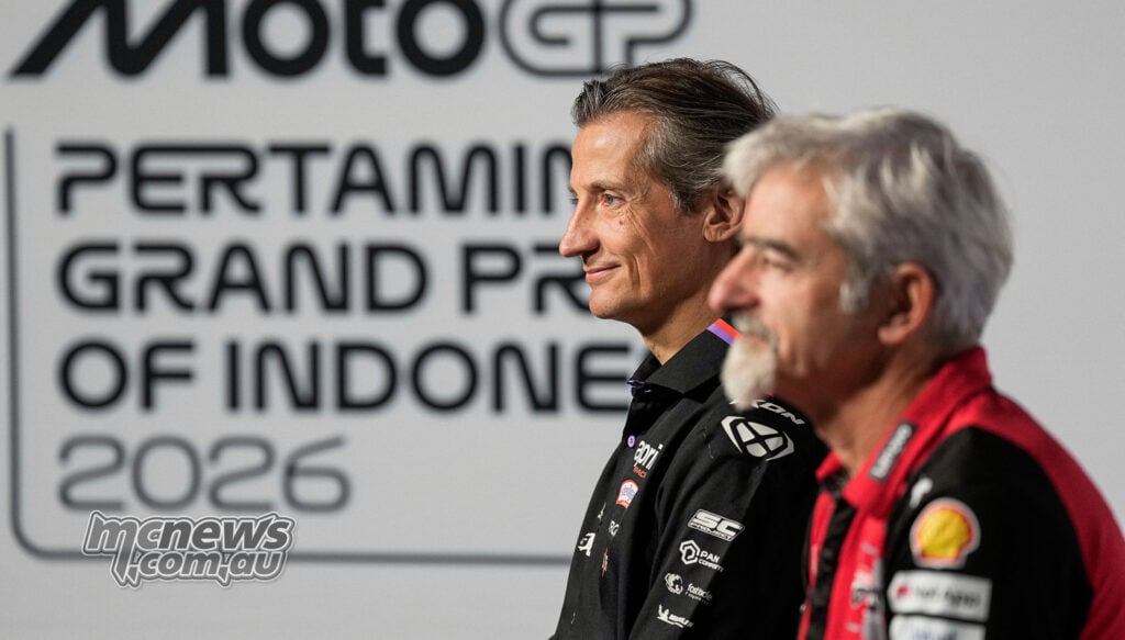 Massimo Rivola in Aprilia team clothing sits beside Gigi Dall'Igna in Ducati colours at the Mandalika media event.