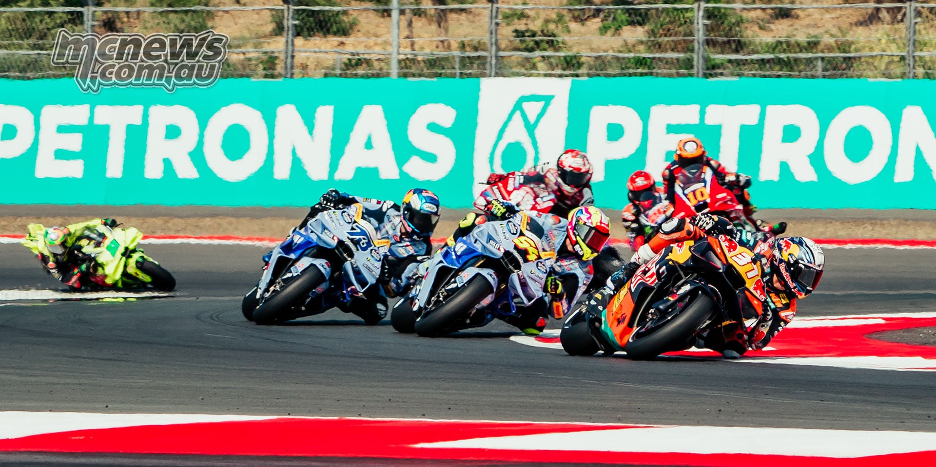 Pedro Acosta leads Fermin Aldeguer and Alex Marquez through a right-hand corner.