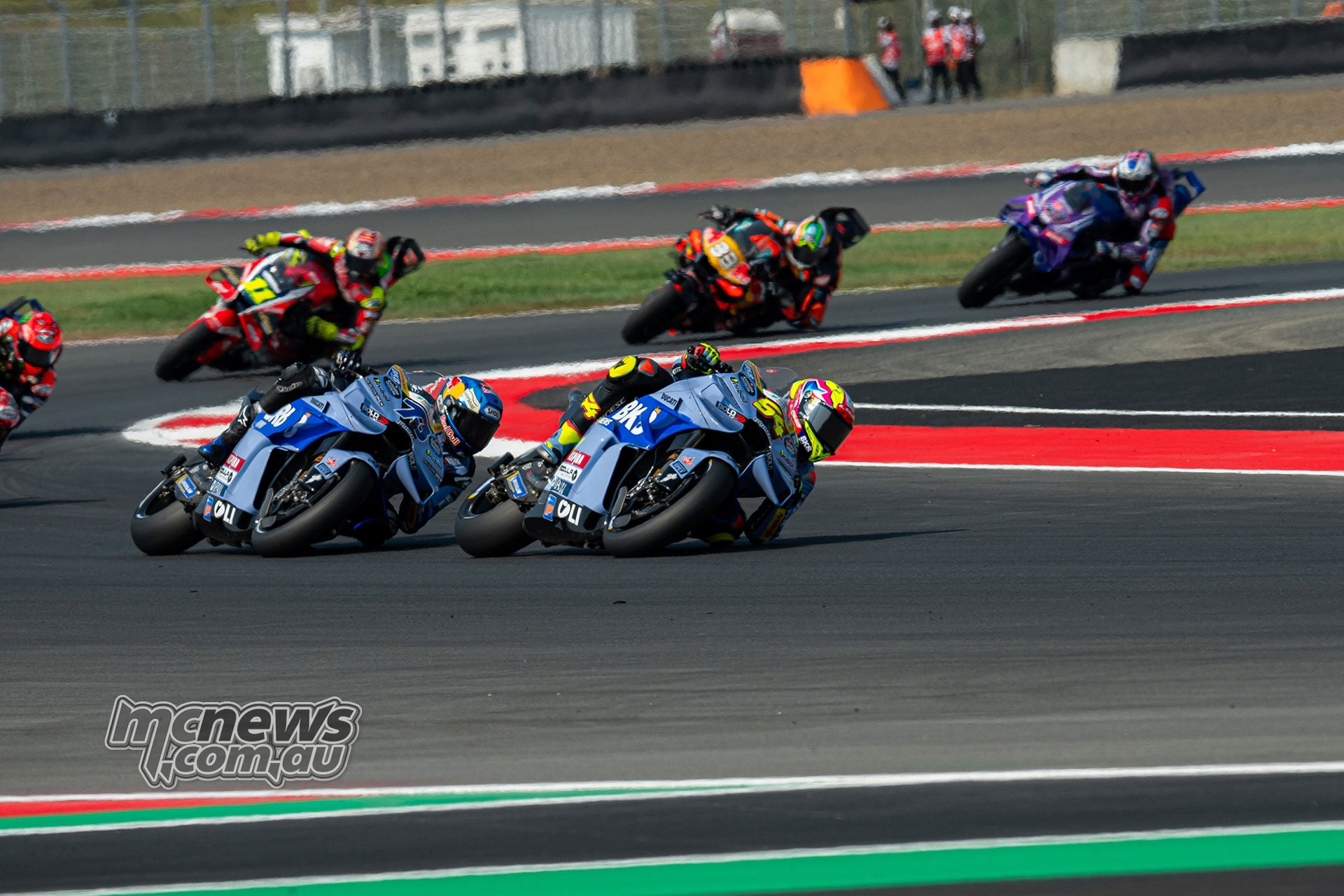 Fermin Aldeguer leads Gresini team-mate Alex Marquez with the chasing pack behind.