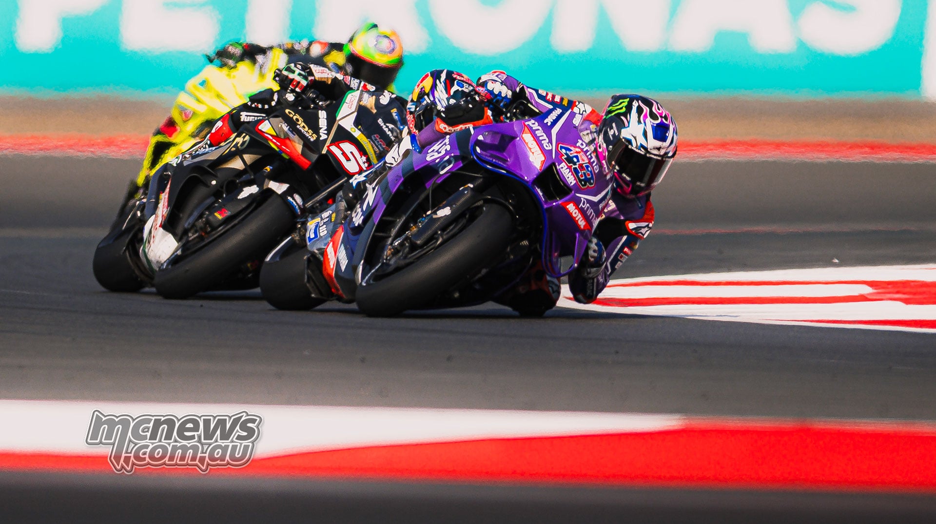 Jack Miller leads Johann Zarco and Franco Morbidelli through a right-hand corner.