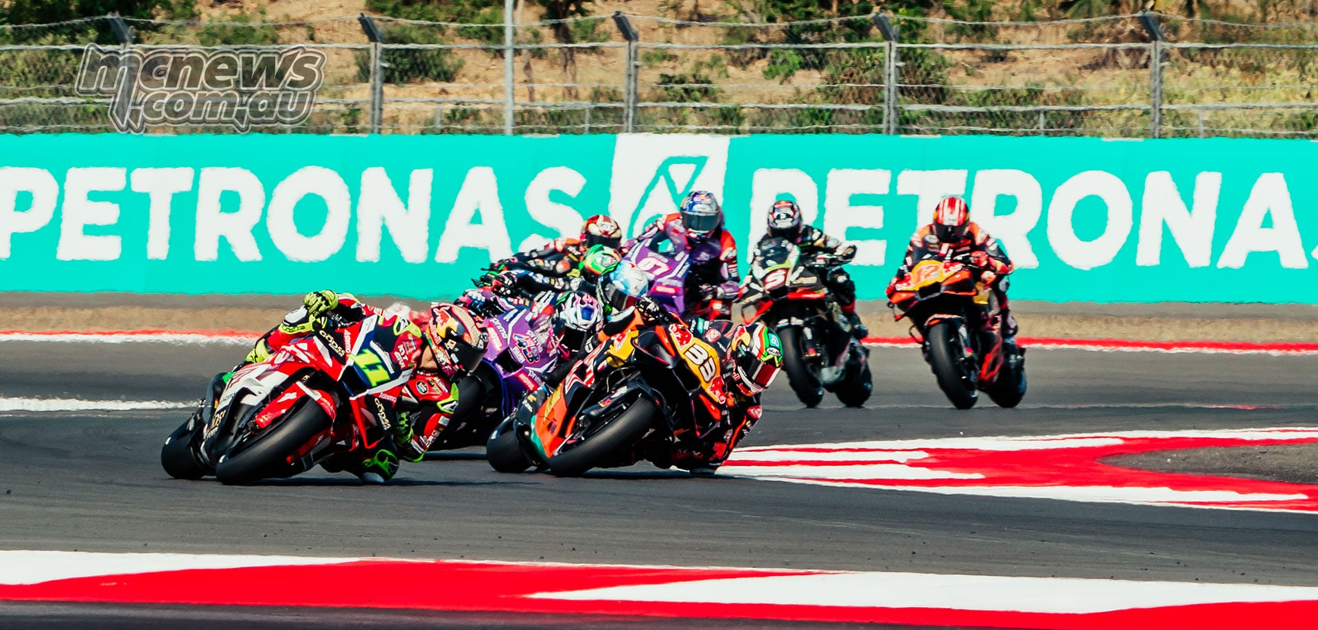 Diogo Moreira, Brad Binder and Jack Miller race closely through a Mandalika corner.