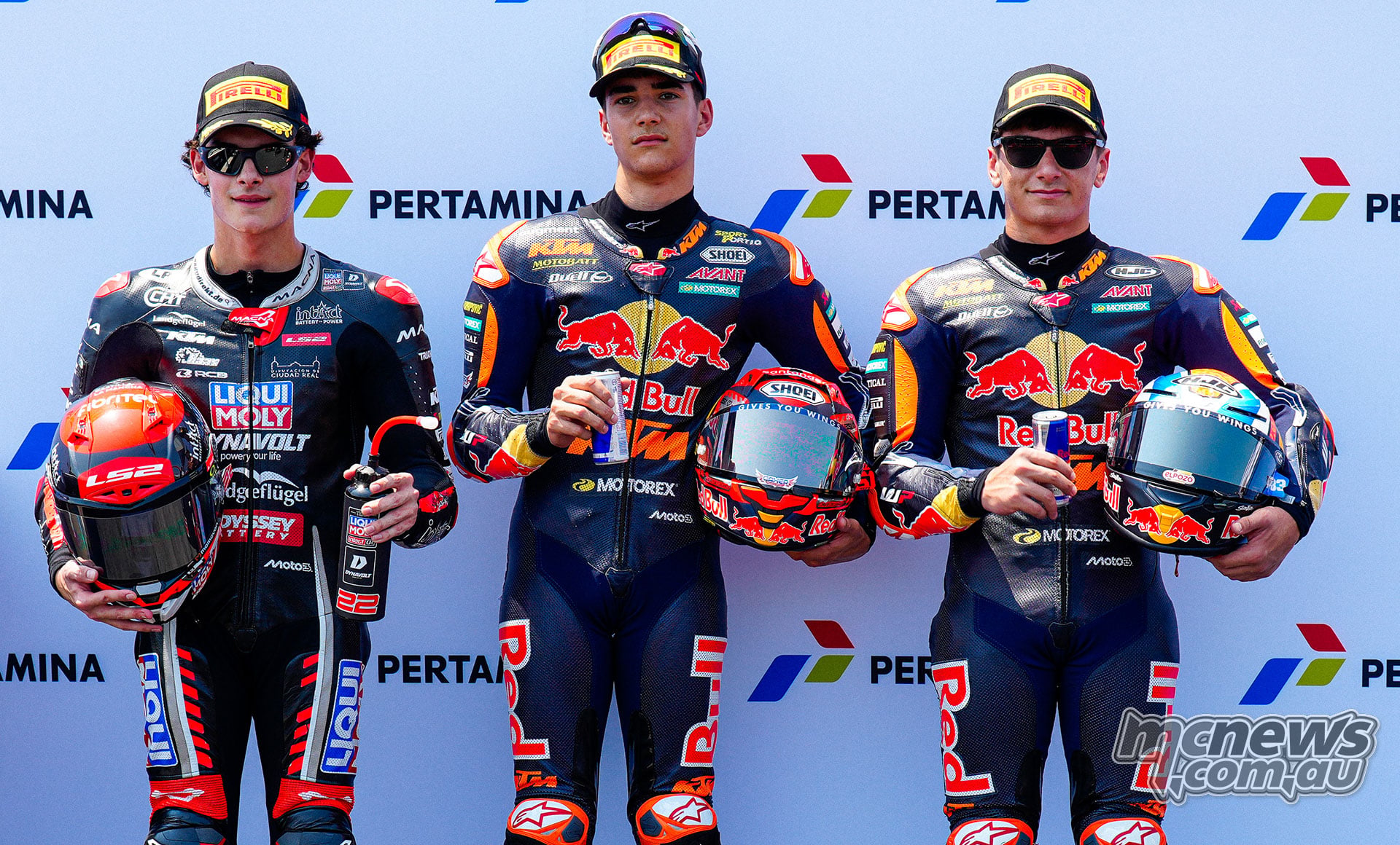 David Almansa, Brian Uriarte and Alvaro Carpe pose after Moto3 qualifying.