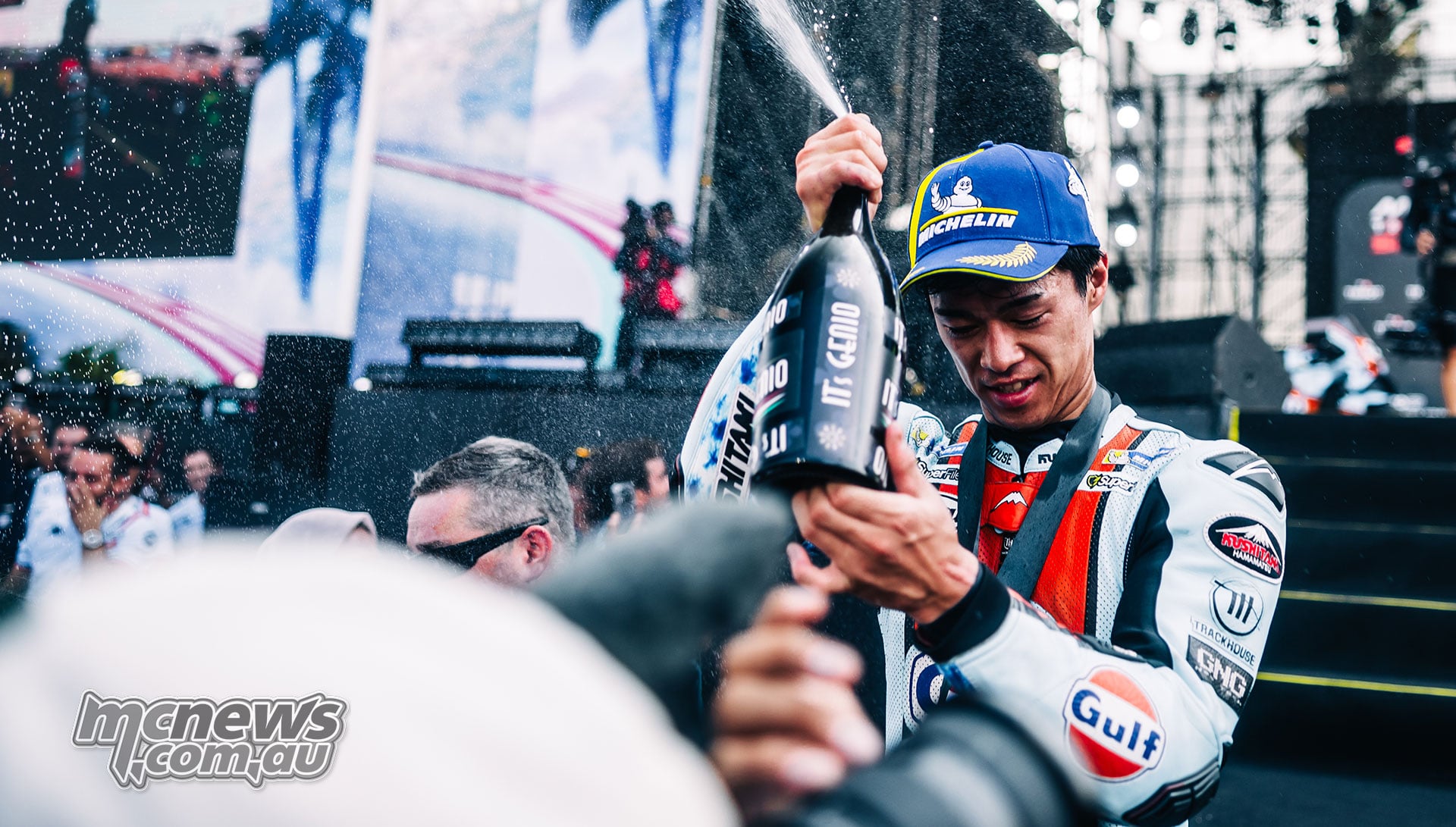 Ai Ogura celebrates with a bottle after finishing second in the Mandalika Sprint.