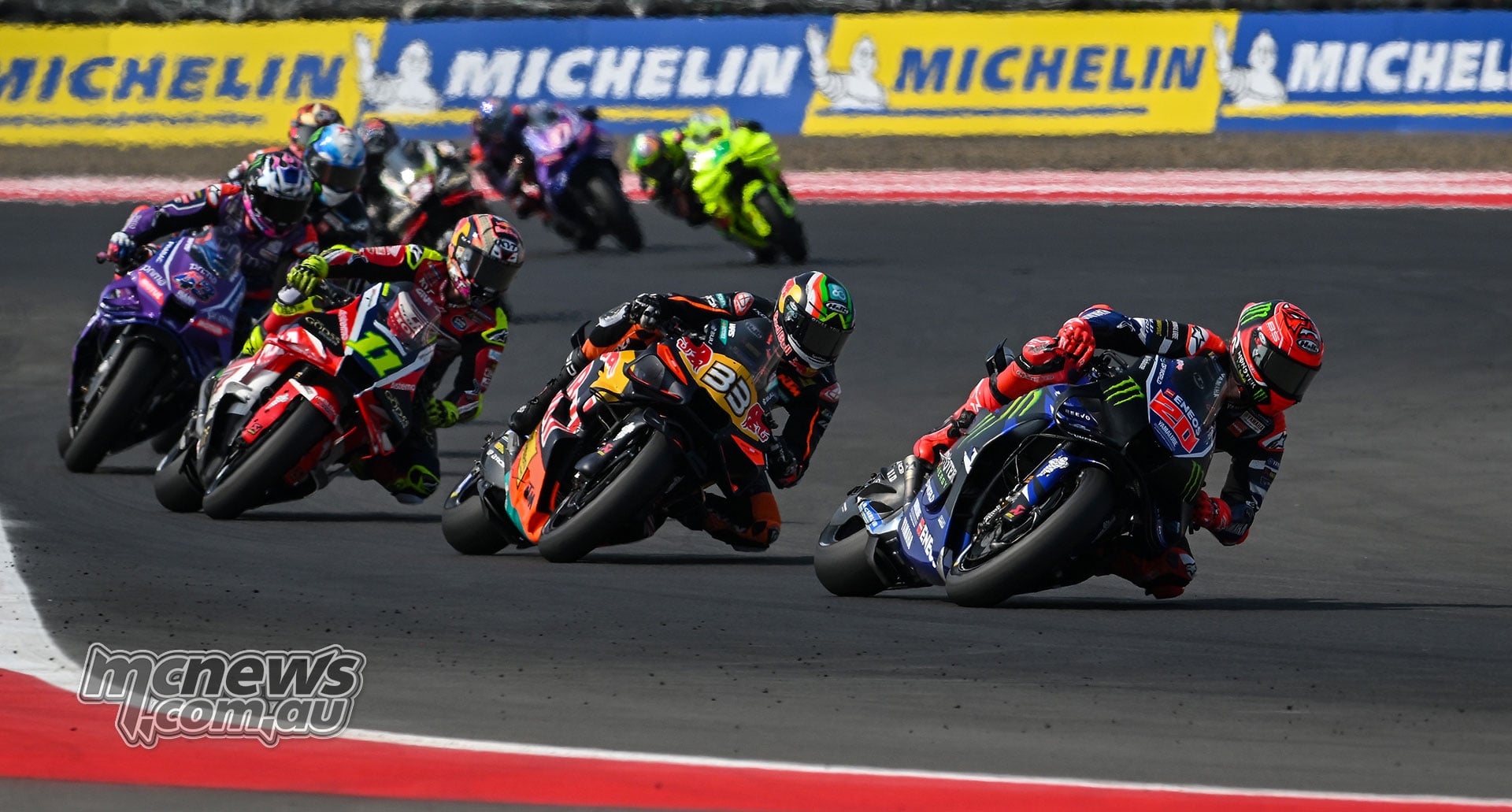 Fabio Quartararo leads Brad Binder, Diogo Moreira and Jack Miller through a corner.