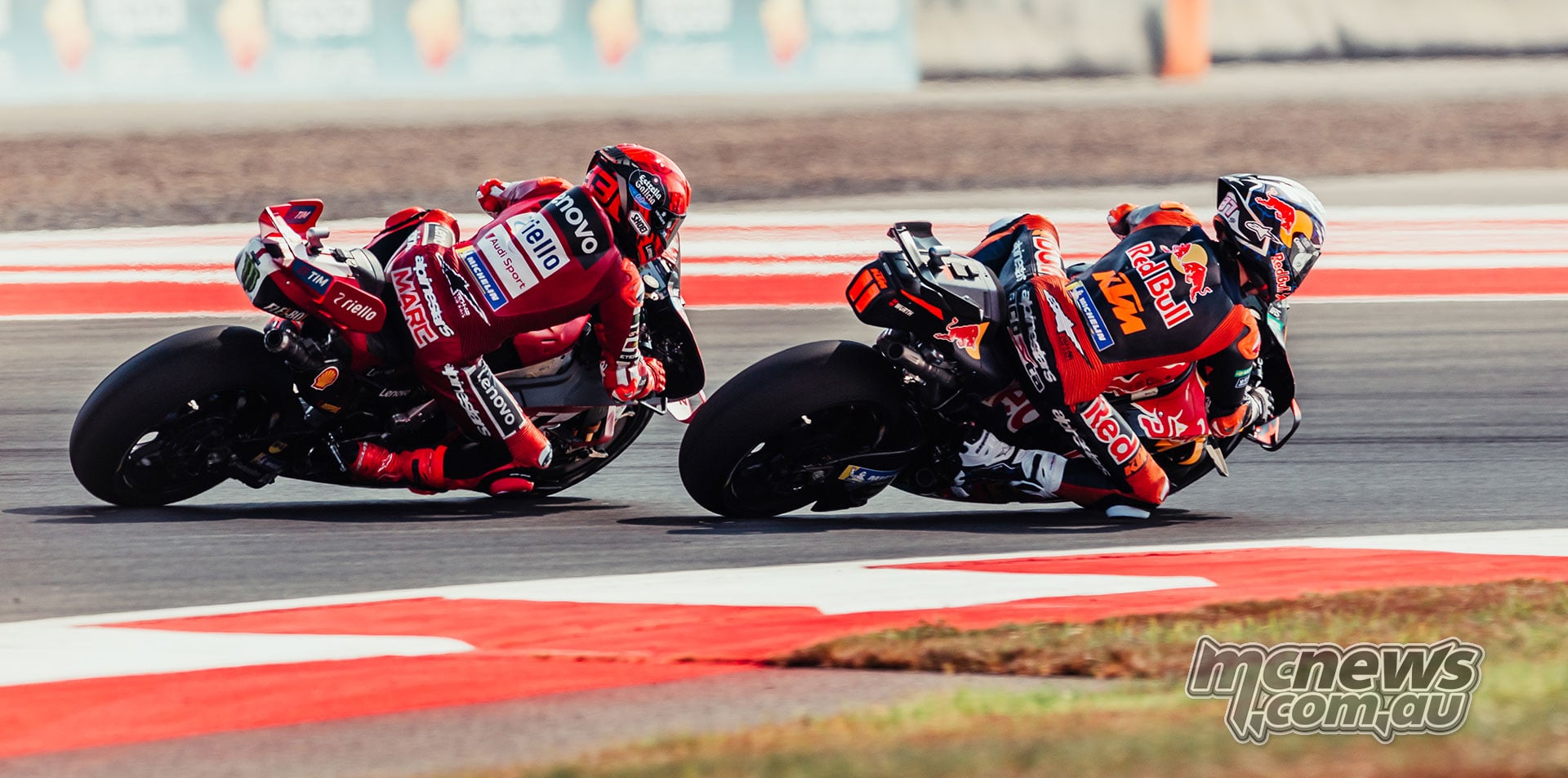 Pedro Acosta on the inside of Marc Marquez as the pair lean through a corner