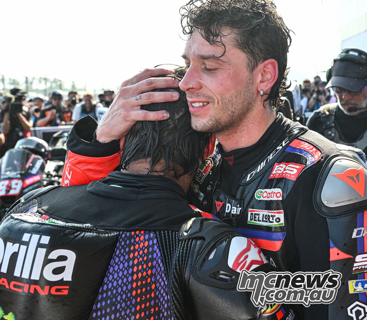 Marco Bezzecchi embracing Aprilia team-mate Jorge Martin in parc ferme