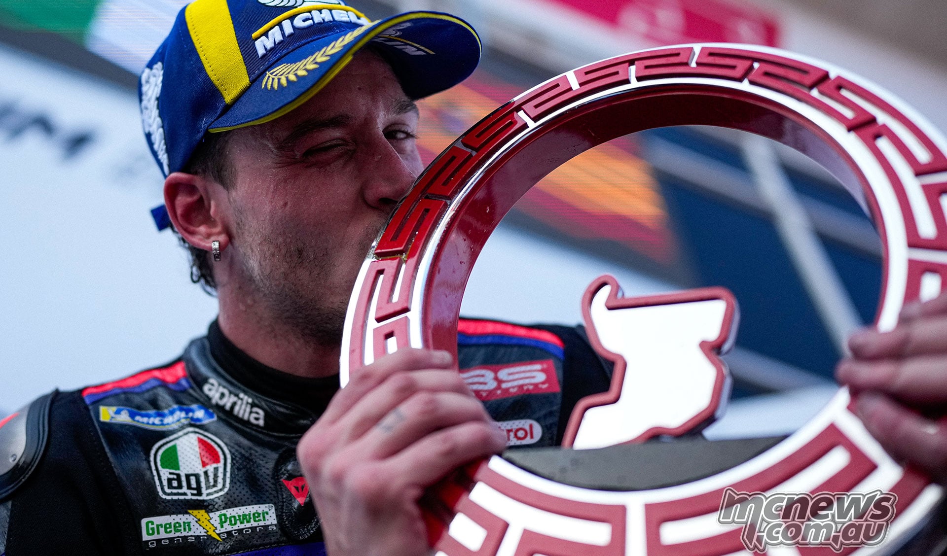 Marco Bezzecchi kissing his red Indonesian Grand Prix trophy