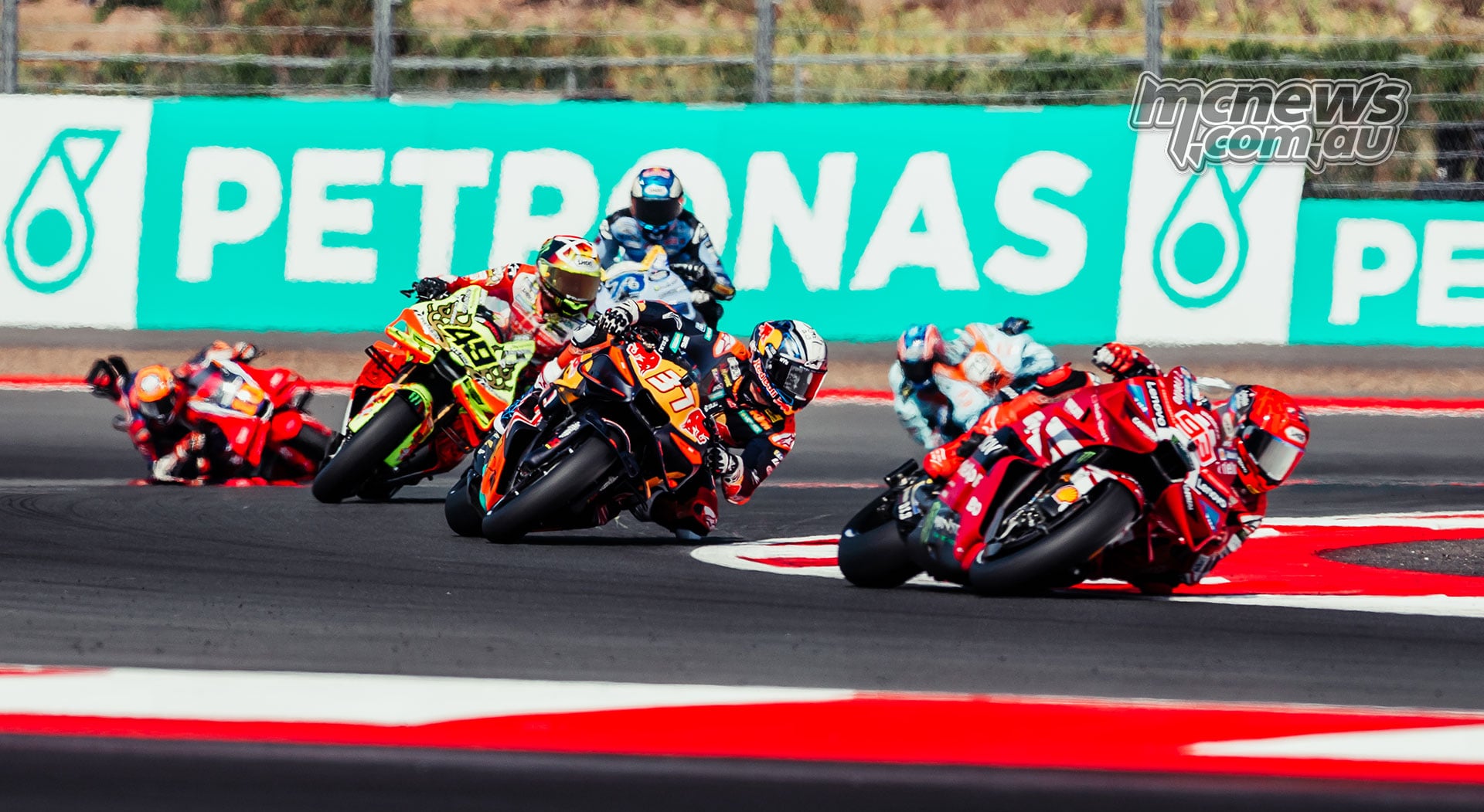 Marc Marquez leading Pedro Acosta and Fabio Di Giannantonio through a right-hand corner
