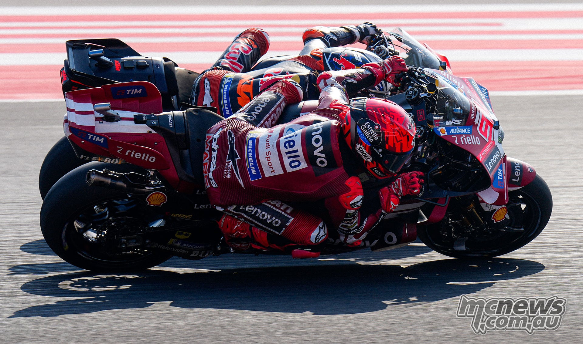 Marc Marquez and Jorge Martin leaning through a corner side by side at Mandalika