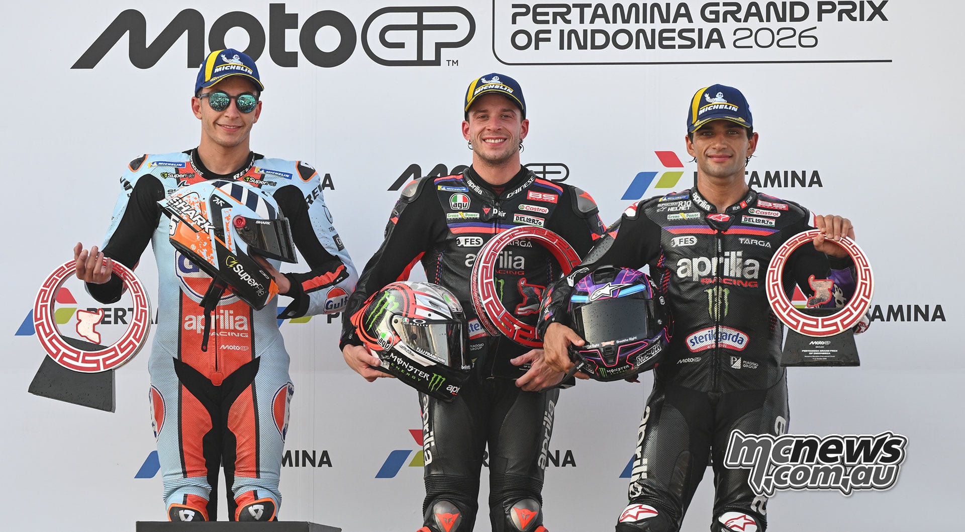 Raul Fernandez, Marco Bezzecchi and Jorge Martin holding their trophies after the Indonesian Grand Prix