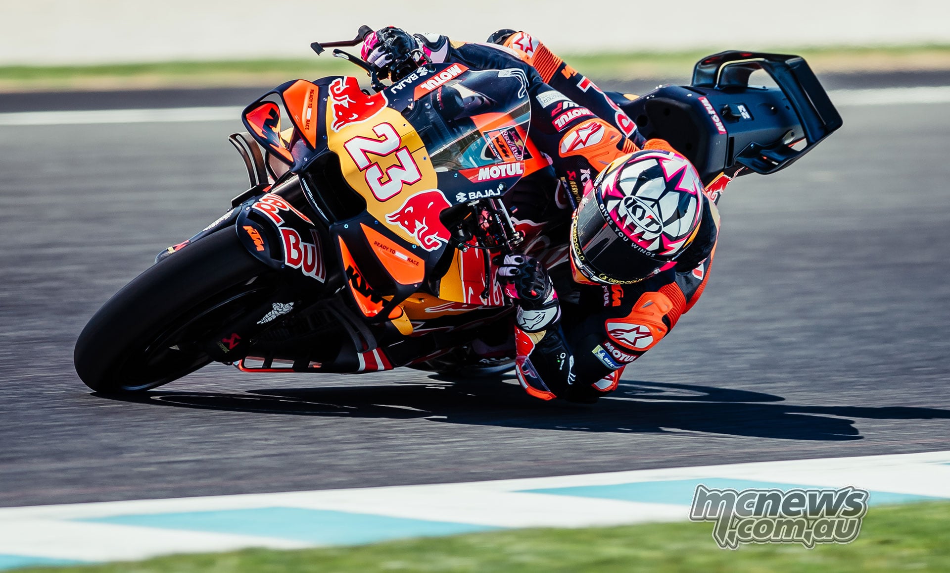 Enea Bastianini corners on his orange number 23 Red Bull KTM Tech3 RC16 at Phillip Island.