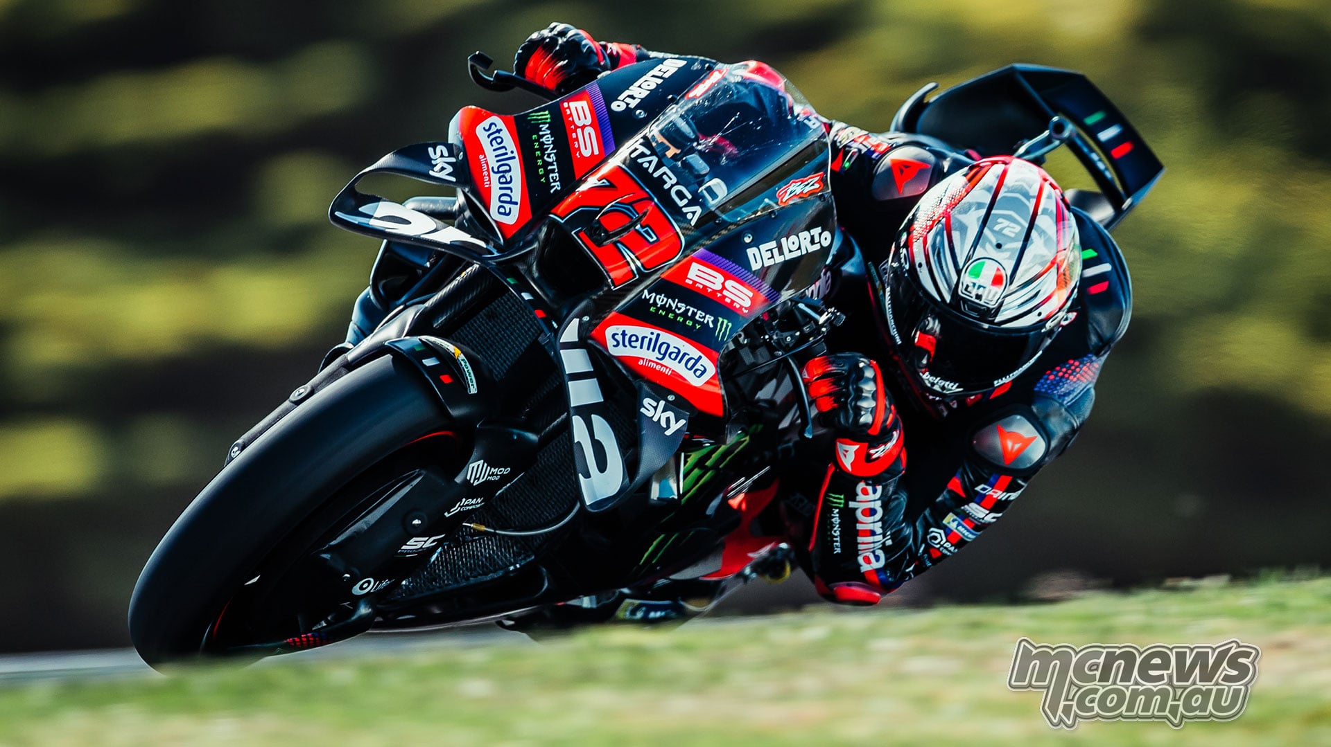 Marco Bezzecchi leans his number 72 Aprilia through Lukey Heights at Phillip Island.