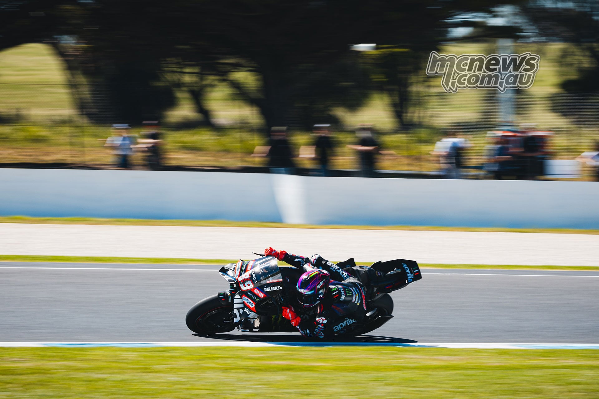 Side view of Jorge Martin leaning his Aprilia through a corner at Phillip Island.