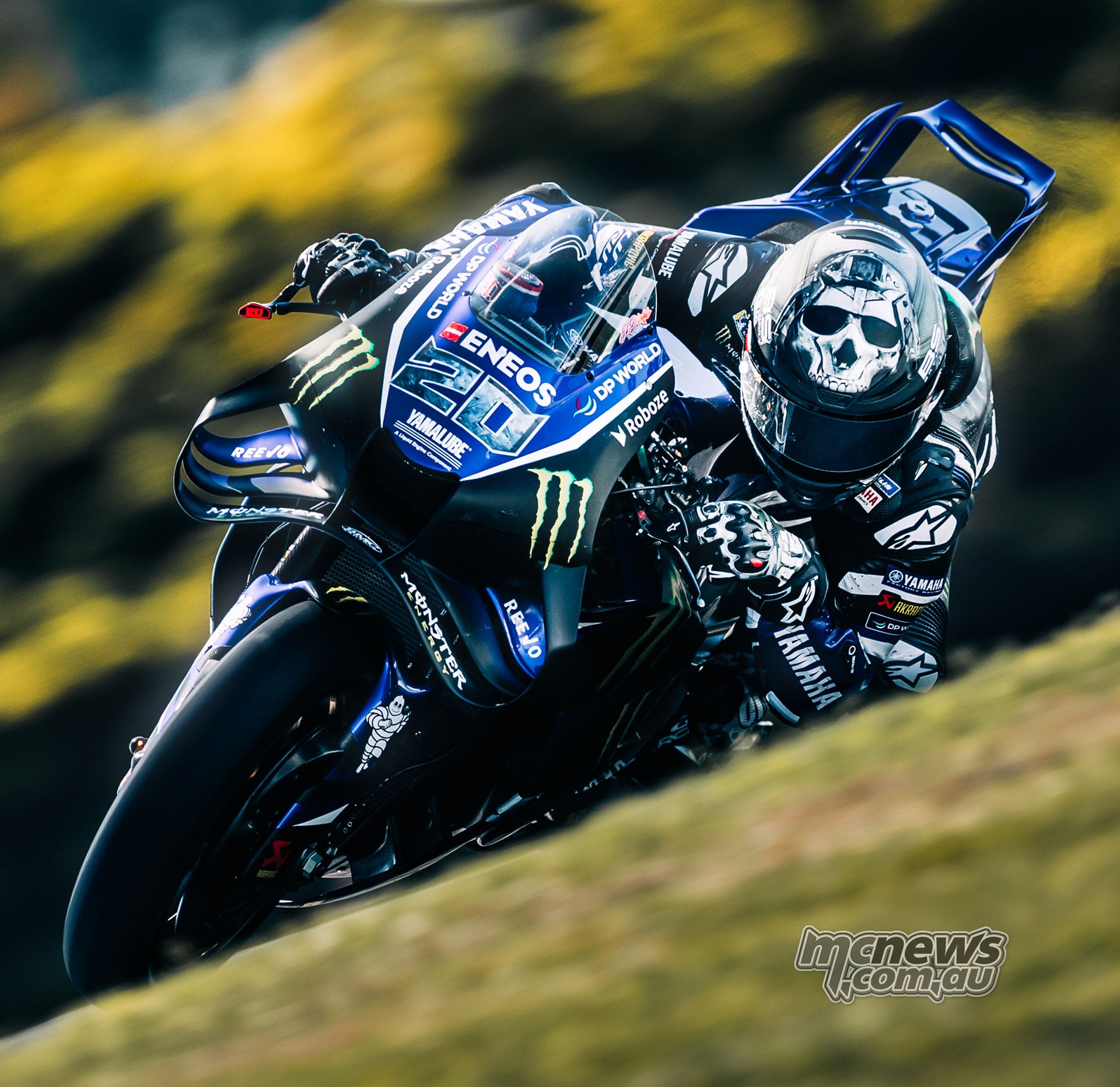 Fabio Quartararo leans his number 20 Yamaha through Lukey Heights wearing a skull-patterned helmet.