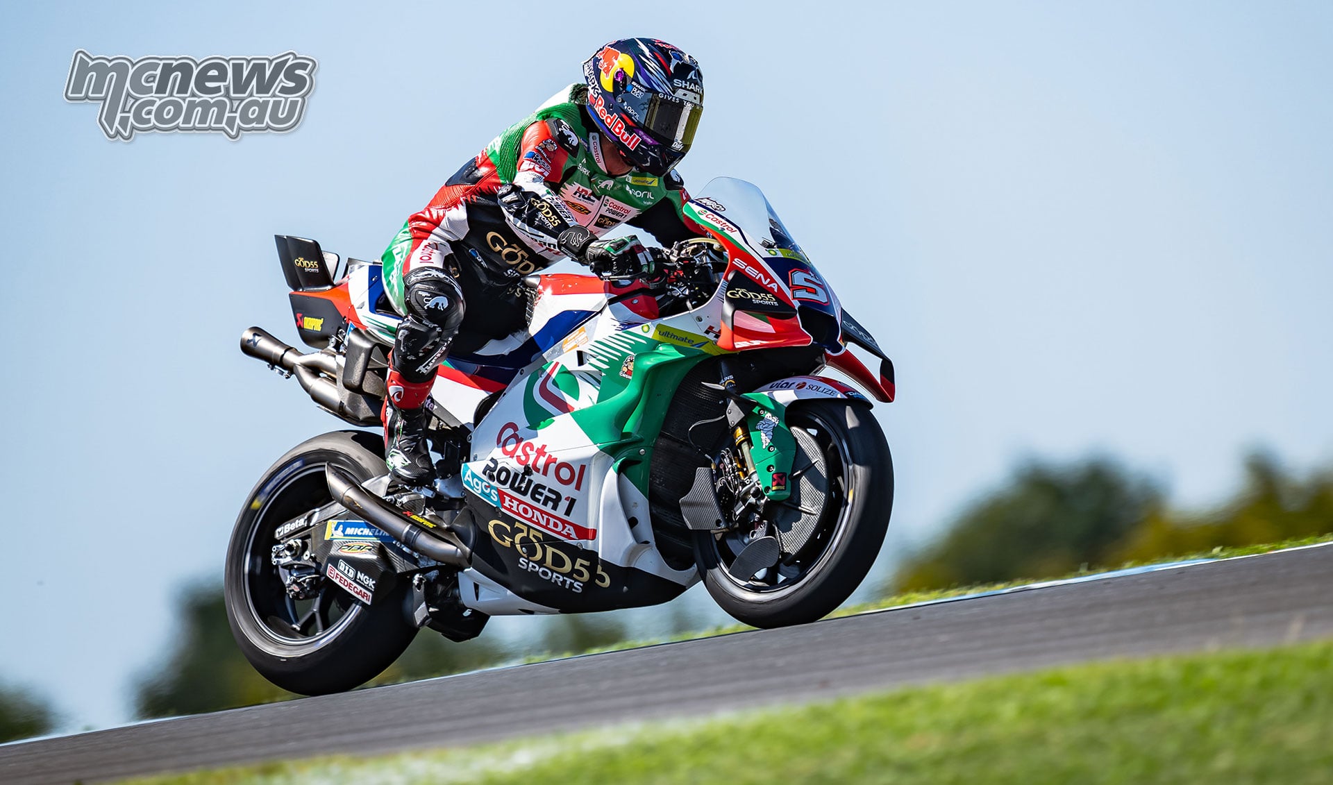 Johann Zarco crests a rise with the front wheel of his Castrol LCR Honda lifted off the track.