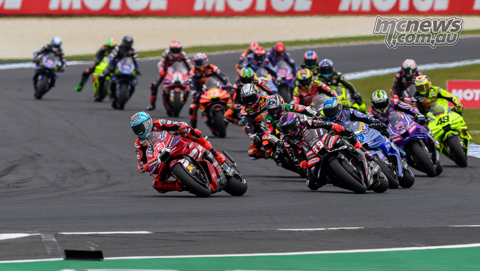 Marc Marquez and Jorge Martin lean into Turn Four ahead of Alex Marquez, Johann Zarco and the chasing pack.