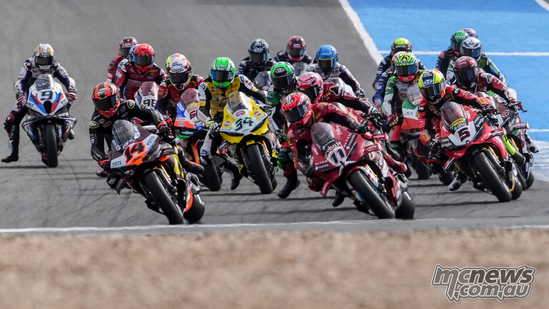 Sam Lowes number 14, Nicolò Bulega number 11 and Yari Montella number 5 lead the WorldSBK field into the opening corner at Jerez