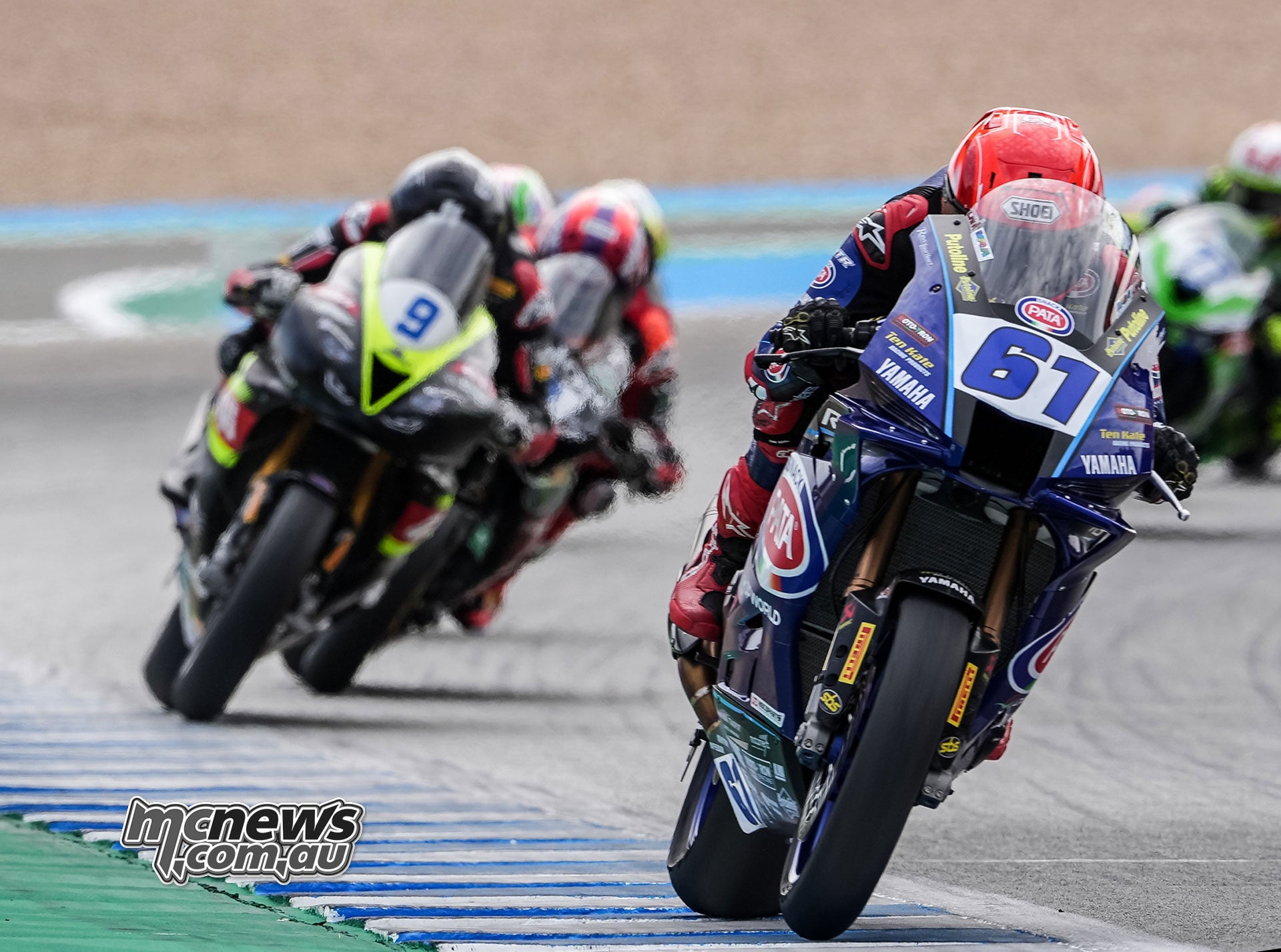 Can Öncü on the blue number 61 Pata Yamaha leads Jorge Navarro on the black and yellow number 9 PTR Triumph at Jerez