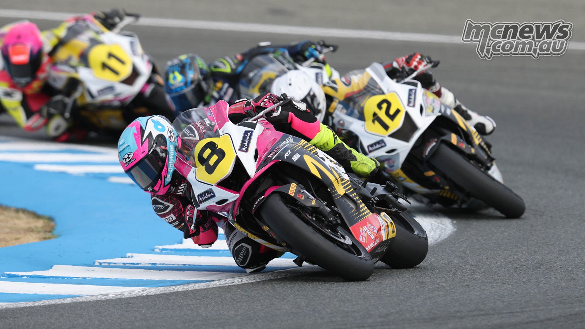 Australian Tayla Relph on the pink number 8 Yamaha R7 leans through a Jerez corner ahead of Muklada Sarapuech on number 12 and Chloe Jones on number 11