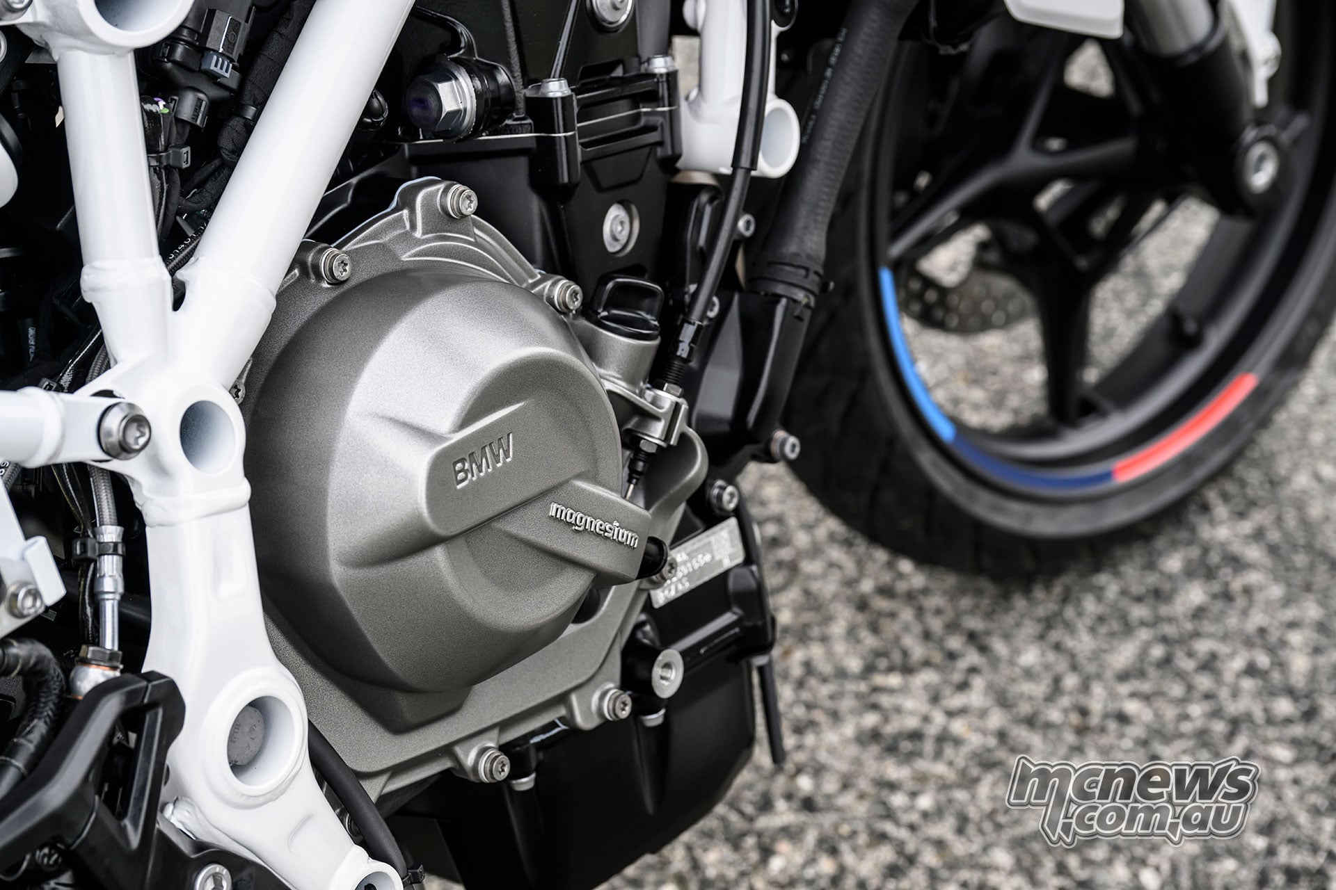 Close-up of the 420 cc parallel-twin engine and white tubular frame of the BMW F 450 R.