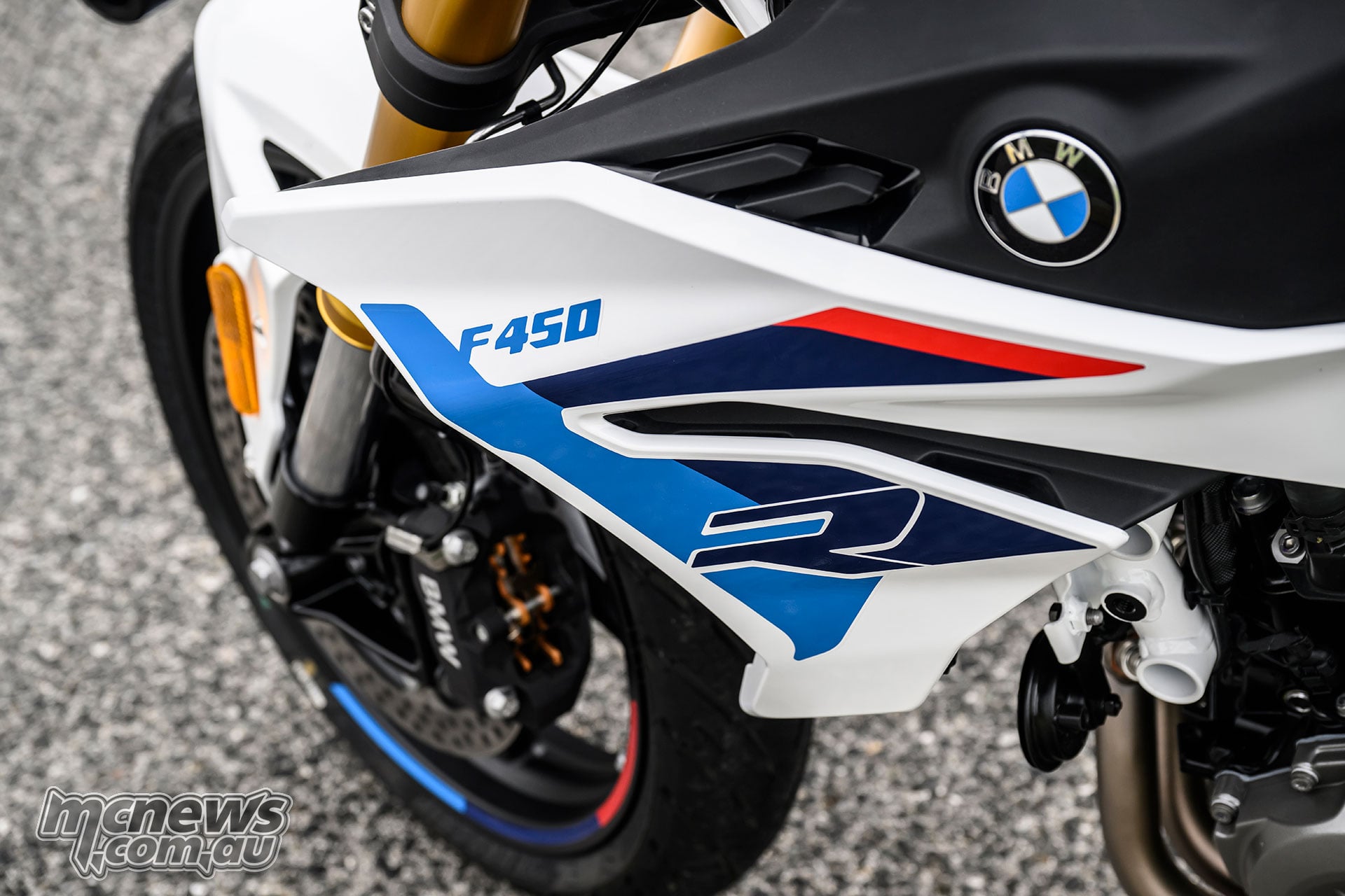 Close-up of the BMW F 450 R M Sport side panel showing F 450 R graphics and BMW roundel.