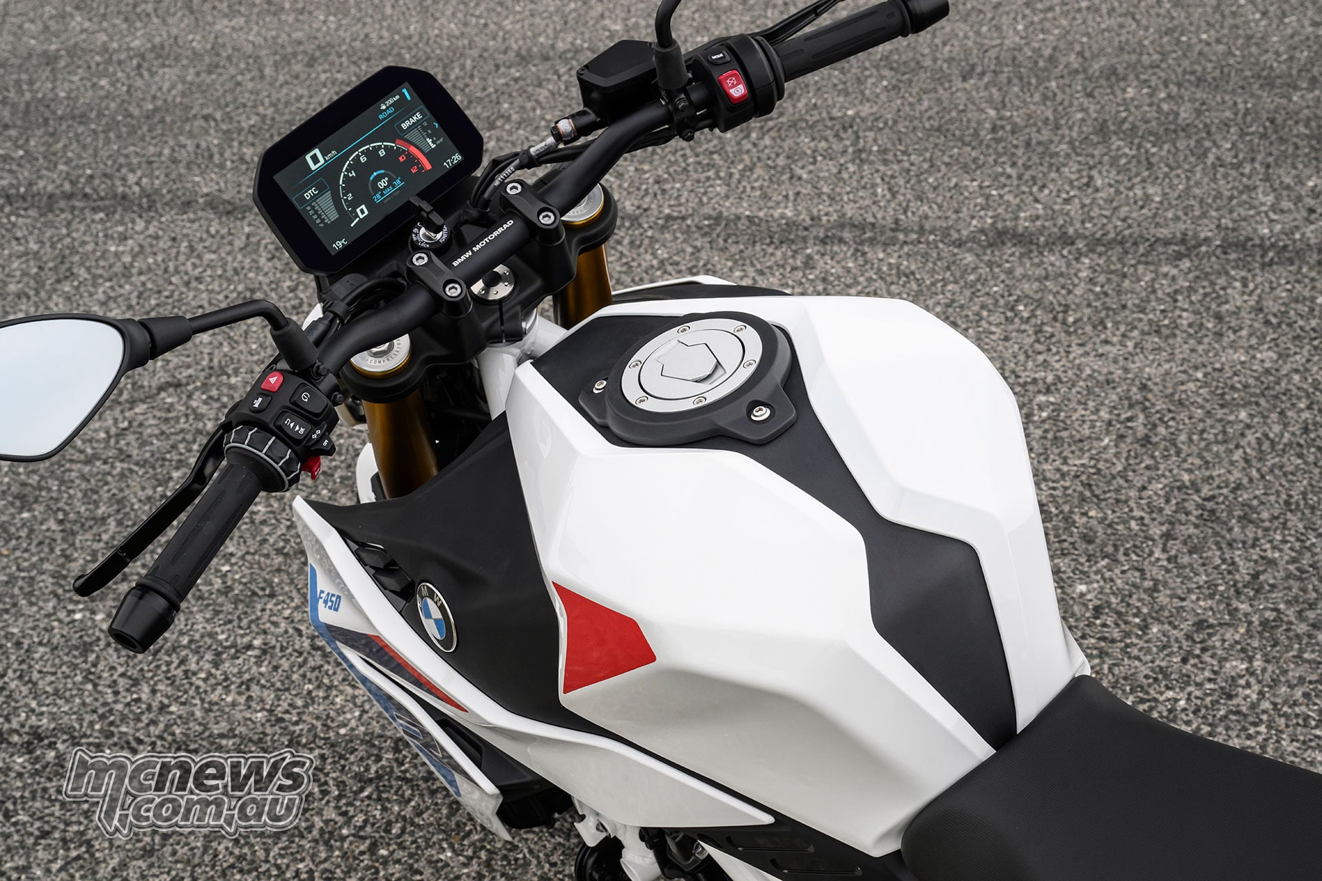 View over the BMW F 450 R fuel tank toward the handlebar and TFT display.