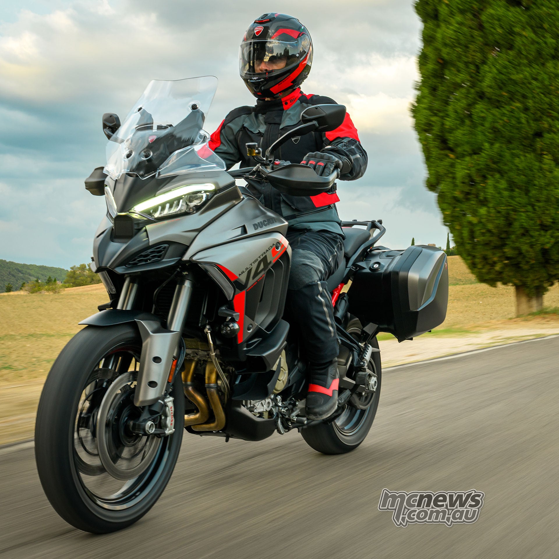 Rider on the 2027 Ducati Multistrada V4 S Grand Tour with side panniers fitted