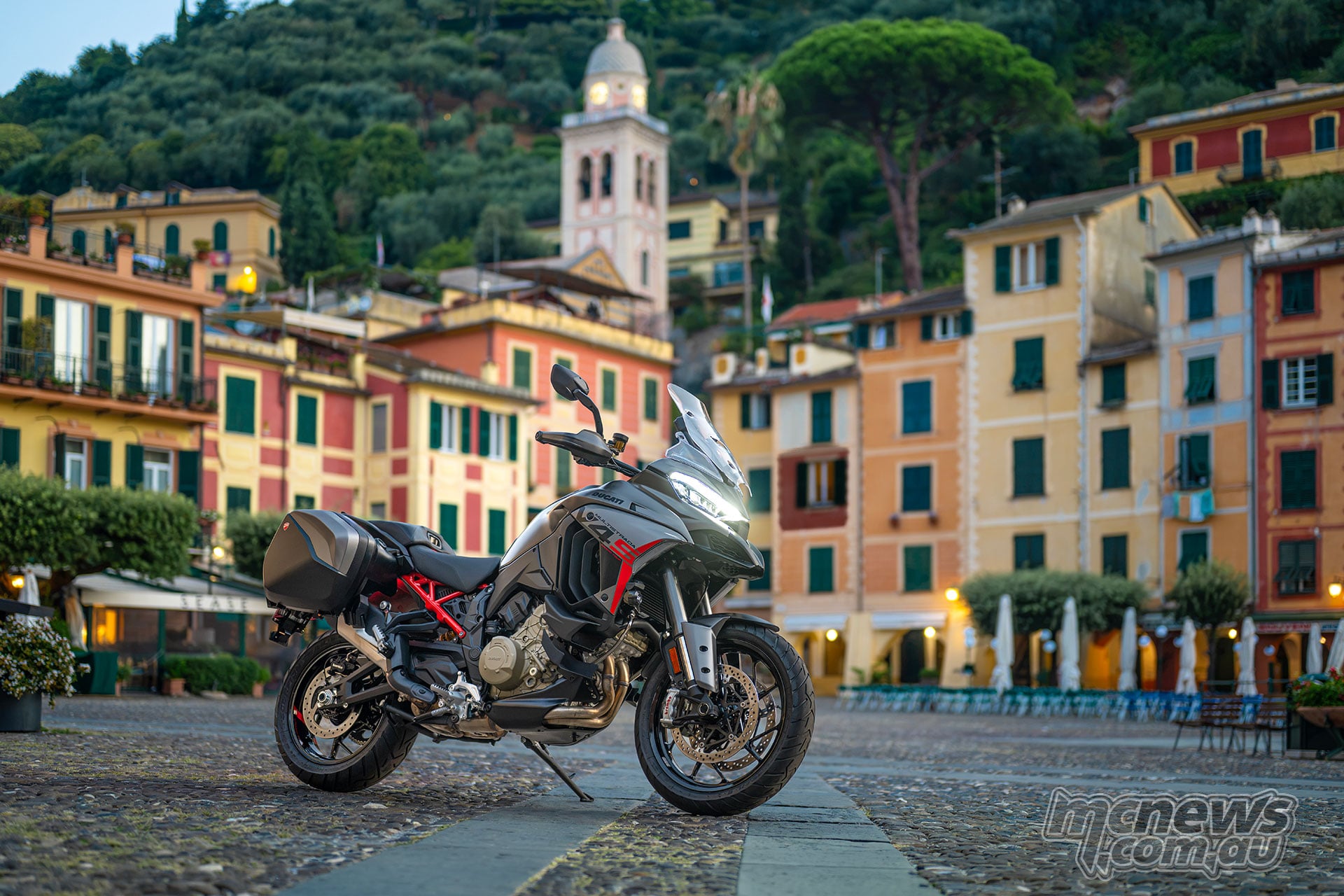 2027 Ducati Multistrada V4 S Grand Tour parked in a picturesque Italian town square
