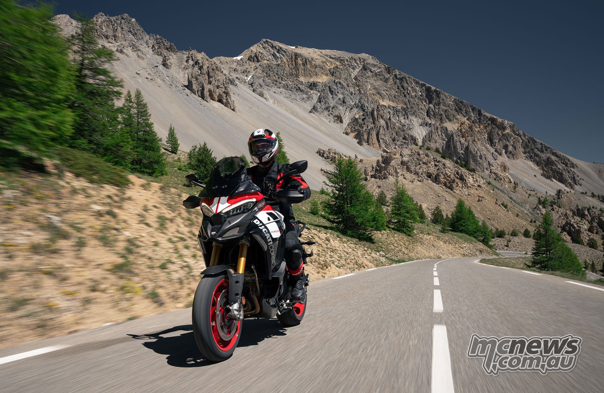 2027 Ducati Multistrada V4 Pikes Peak being ridden along an open mountain road