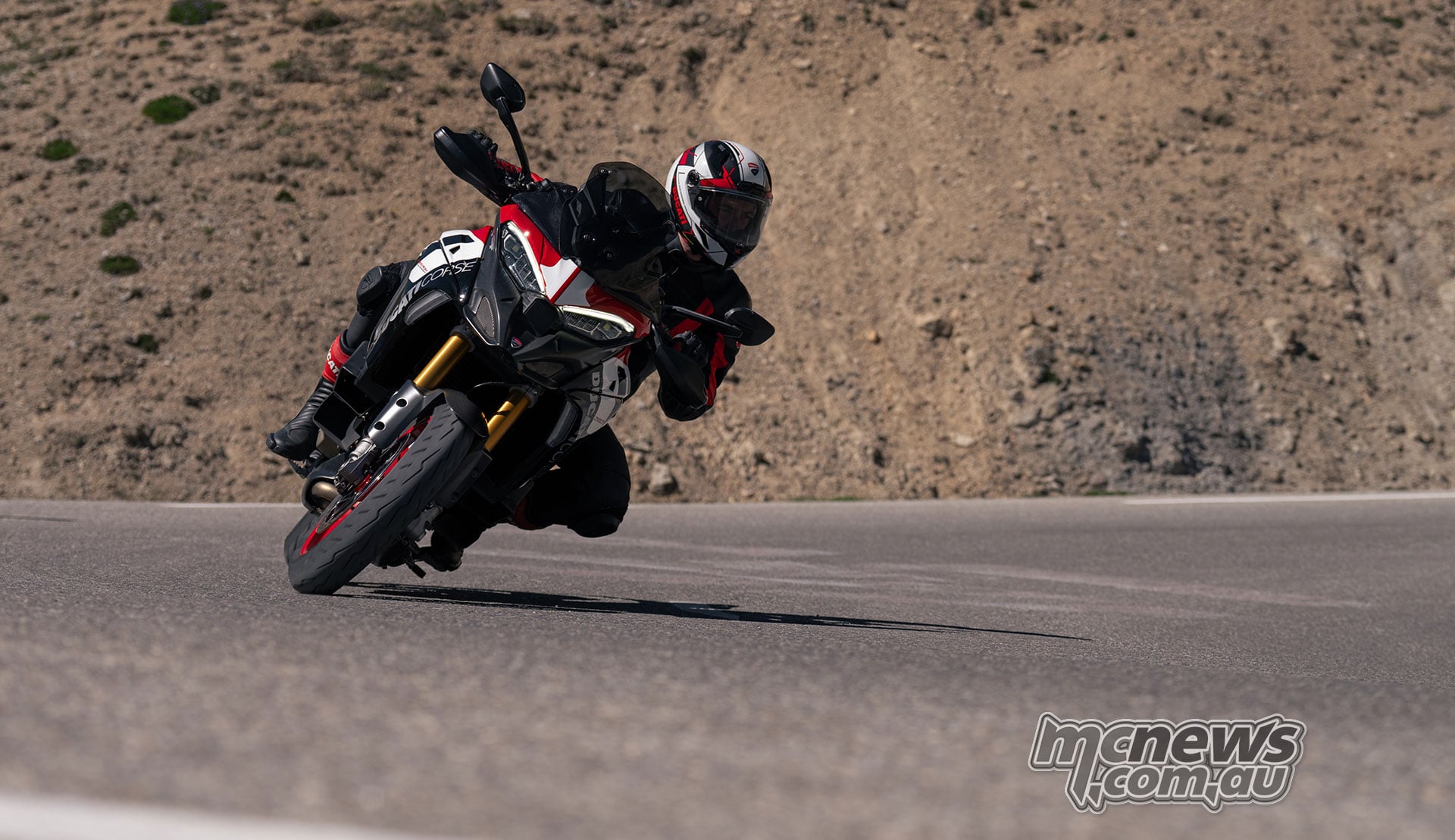 2027 Ducati Multistrada V4 Pikes Peak leaned hard through a fast road corner