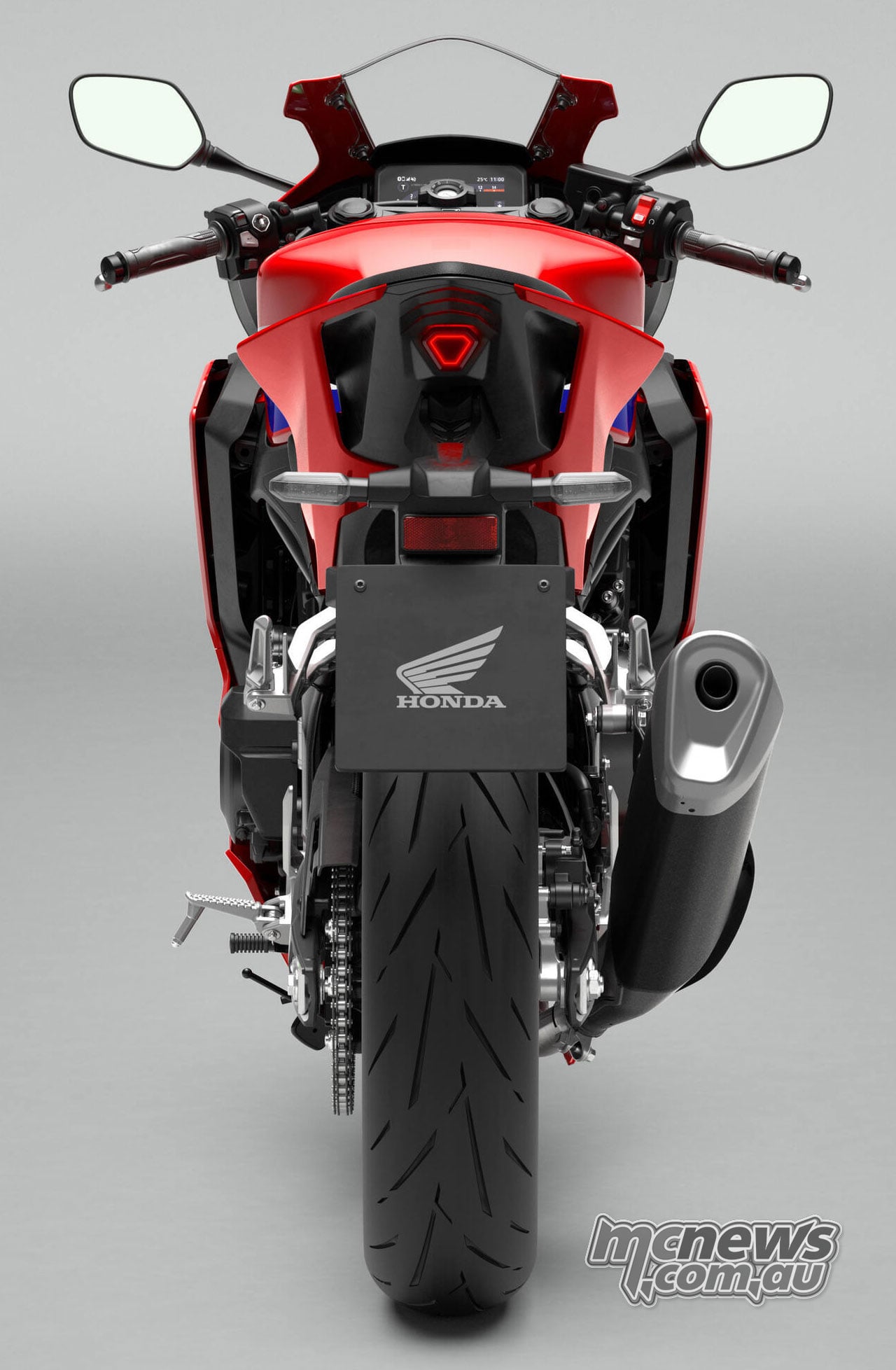 Direct rear studio view of the 2027 Honda CBR500R FOUR showing its tail, rear tyre, mirrors and right-side exhaust