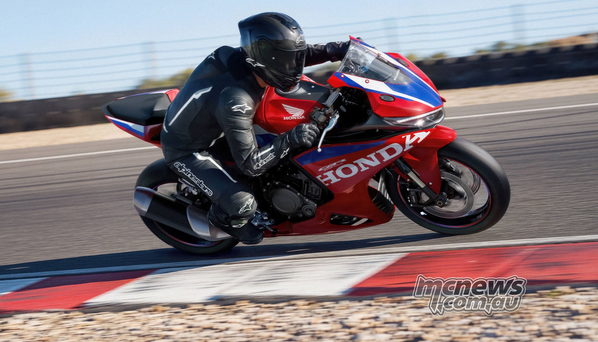 Rider leaning the red 2027 Honda CBR500R FOUR through a circuit corner beside red and white kerbing