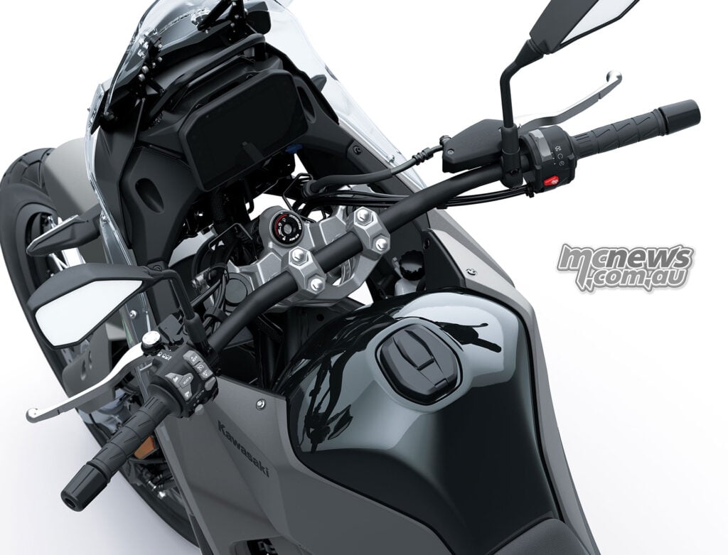Oblique view over the standard Kawasaki KLE650 fuel tank, steel handlebar and instrument panel.