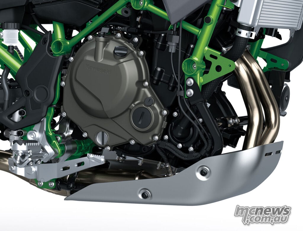 Close-up of the Kawasaki KLE650 SE engine, exhaust headers and aluminium skid plate.