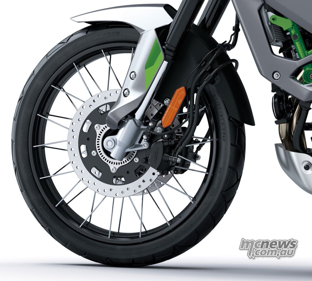 Close-up of the Kawasaki KLE650 SE front spoked wheel, brake disc, caliper and fork leg.