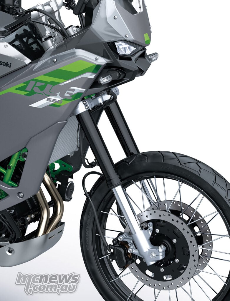 Kawasaki KLE650 SE front wheel, black fork legs, low front mudguard and side fairing.
