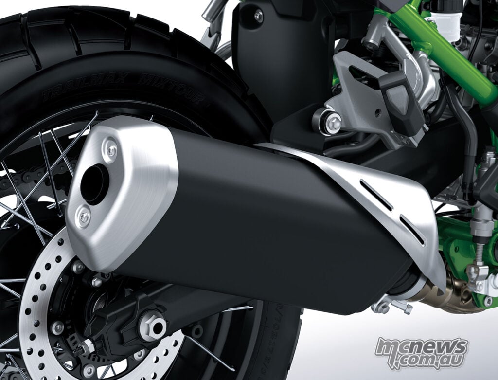 Black and silver upswept exhaust silencer beside the Kawasaki KLE650 SE rear wheel.