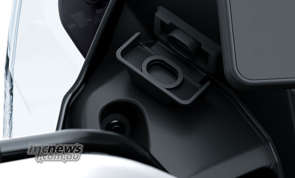 Kawasaki KLE650 SE USB-C charging socket with its protective cover open beside the dashboard.