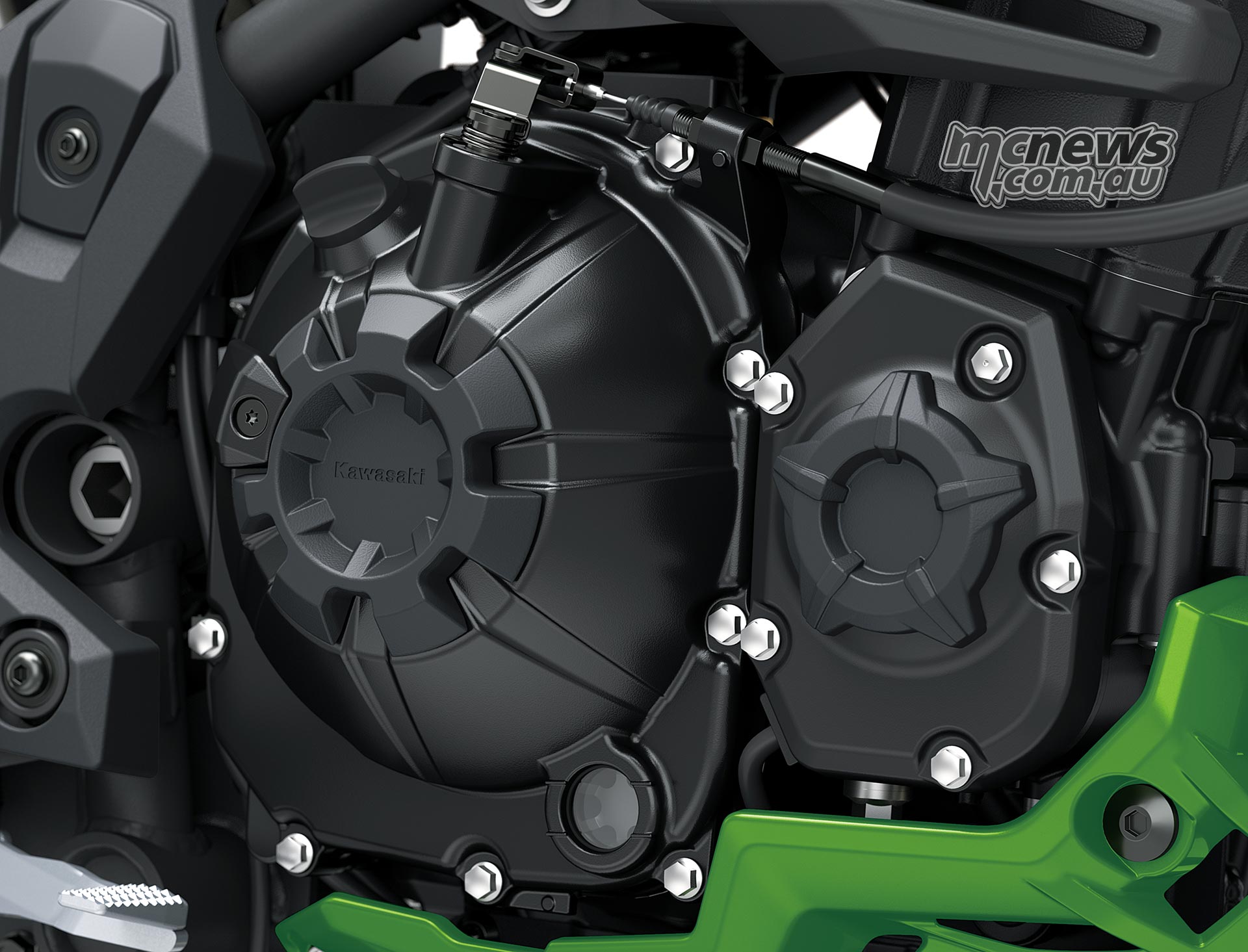 Accessory black rings fitted around two engine covers on the Kawasaki Versys 900 SE