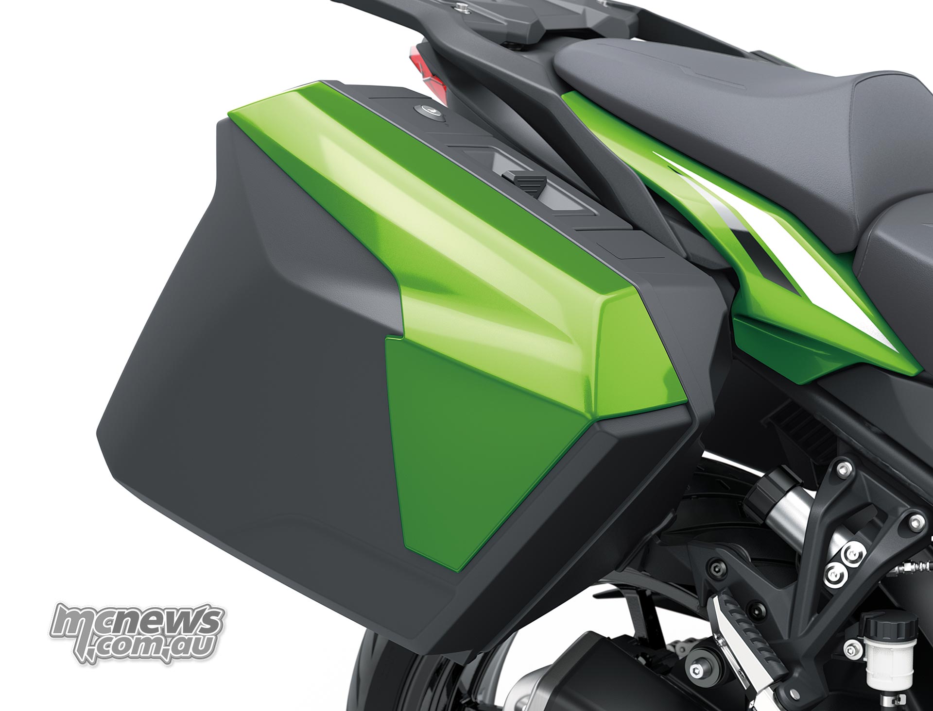 Green colour-matched hard pannier mounted beside the Kawasaki Versys 900 SE passenger seat
