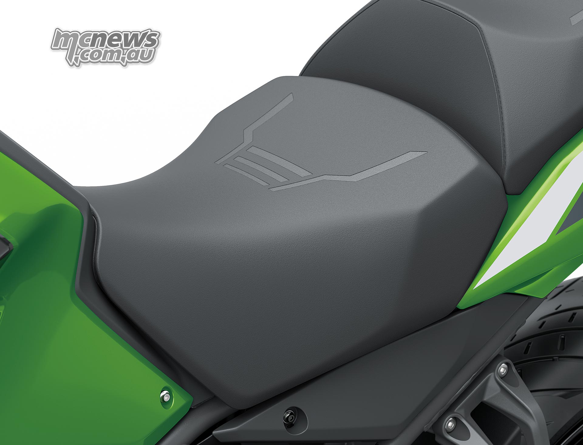 Close-up of the accessory tall black rider seat on a green Kawasaki Versys 900 SE